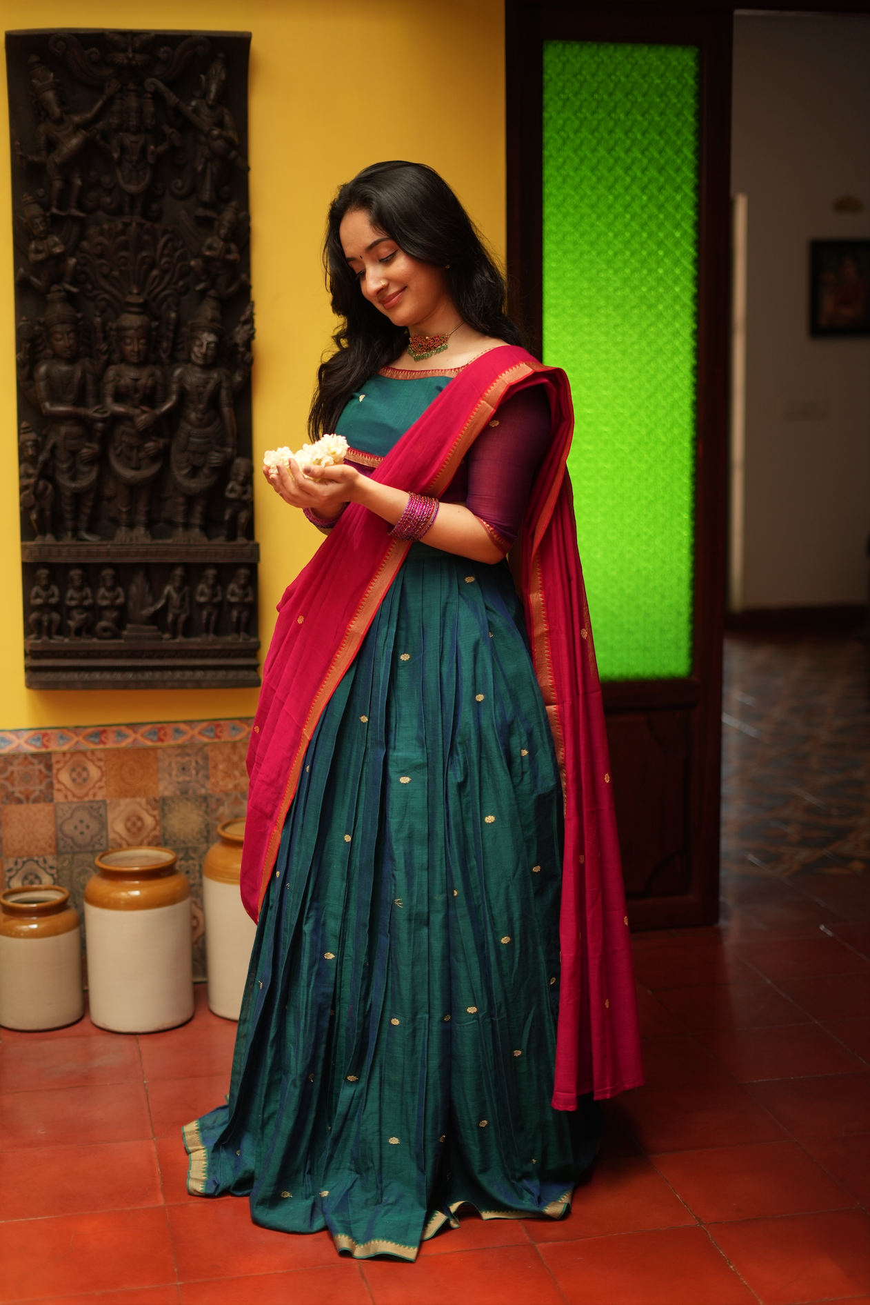 Traditional handloom half saree for women featuring elegant langa dhavani design with rich woven details and festive ethnic styling